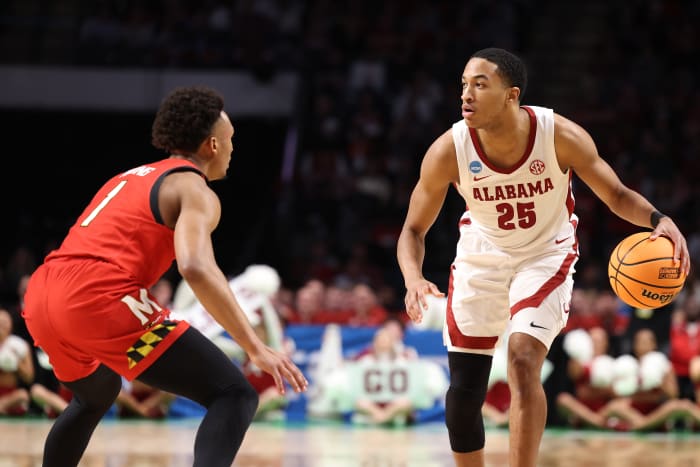 Alabama Guard Nimari Burnett (25) dribbles the ball against Maryland at Legacy Arena - Birmingham in Tuscaloosa, AL on Saturday, Mar 18, 2023.